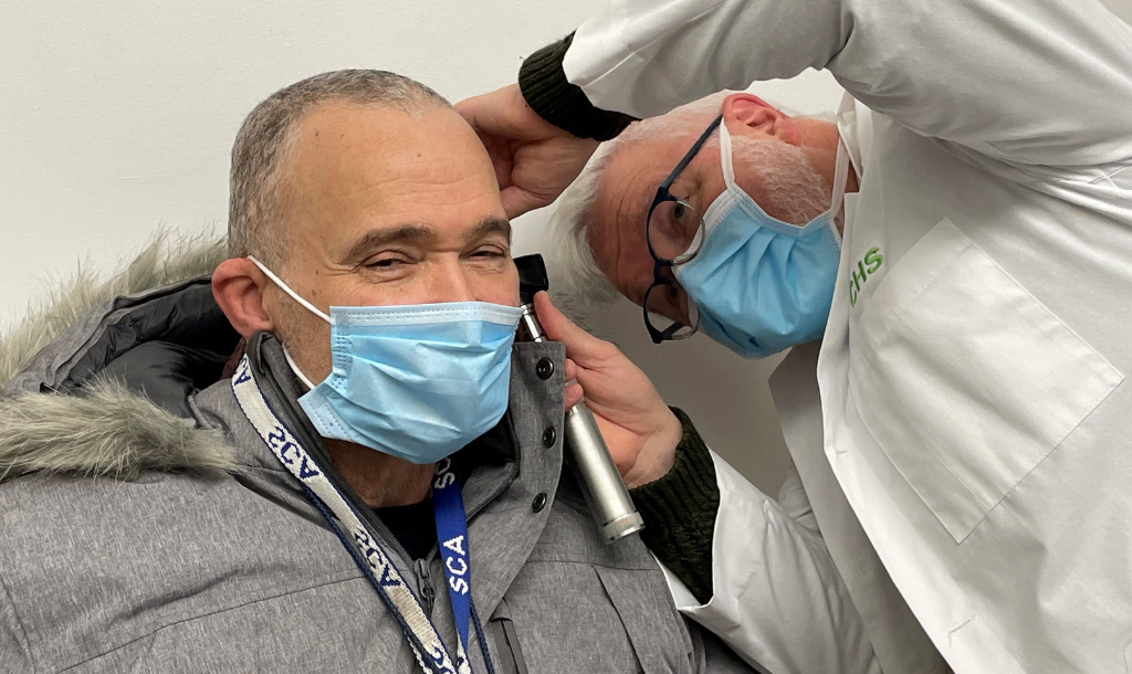 An audiology patient getting his ears checked